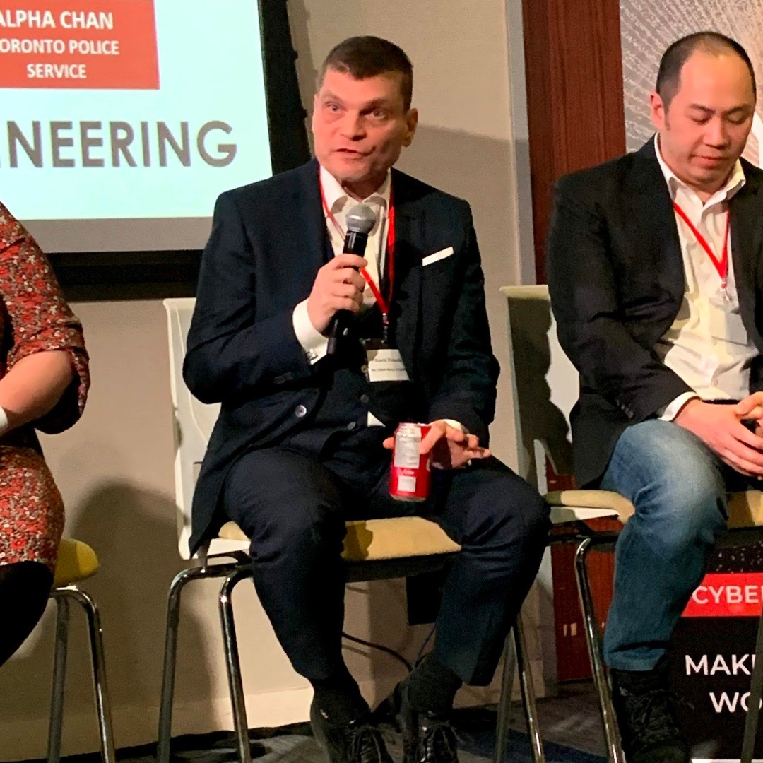 Kevin speaking on a panel at an industry conference